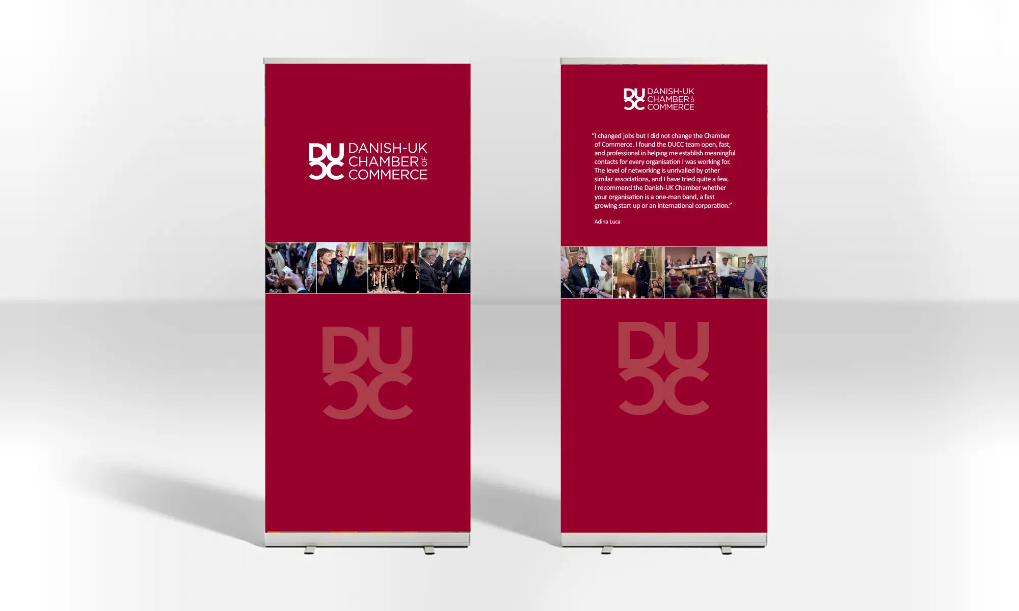 Two elegant red display banners for Danish UK Chamber of Commerce with photos and text.