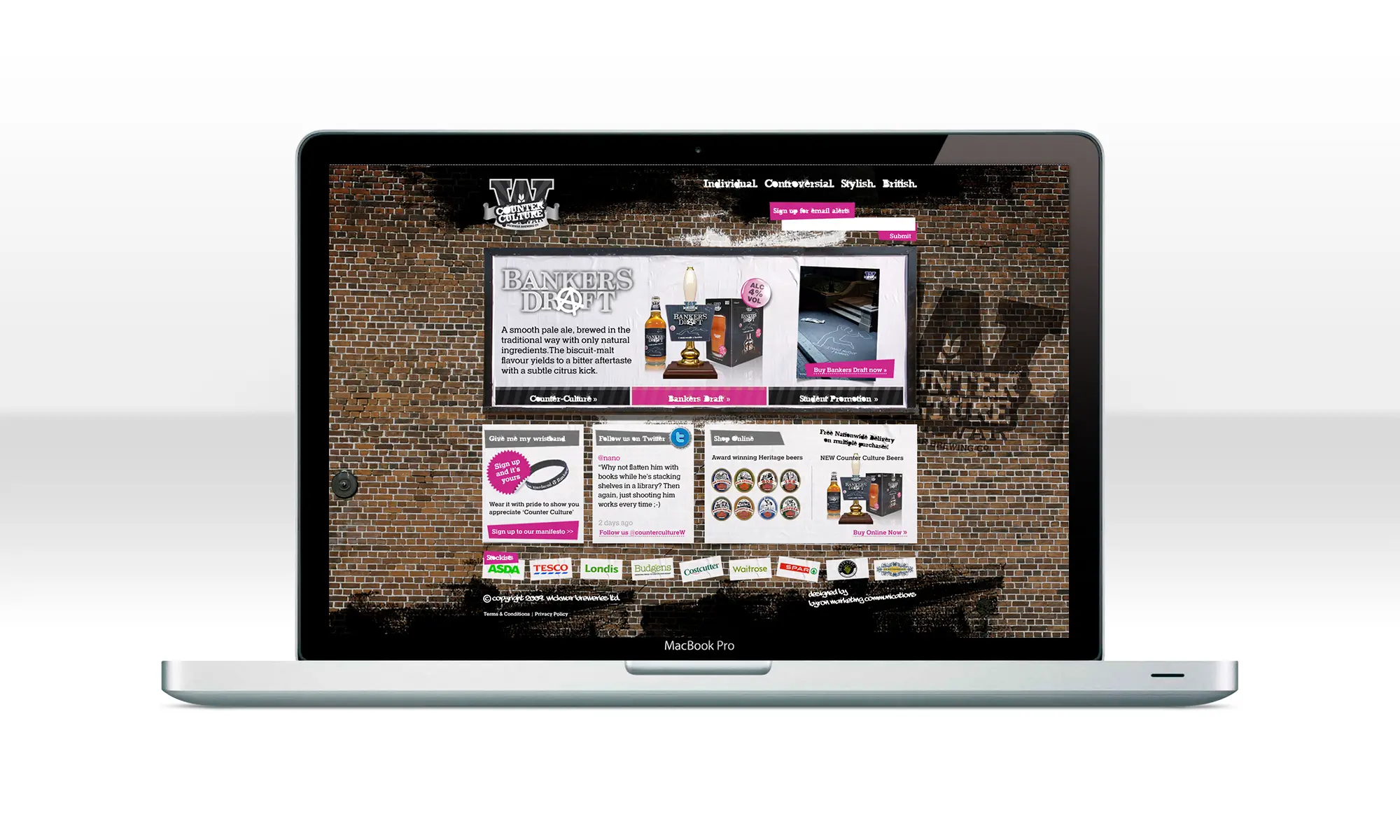Website Copywriting & Tone of Voice: Wickwar counter-culture website showcased on a laptop with a brick wall design background.