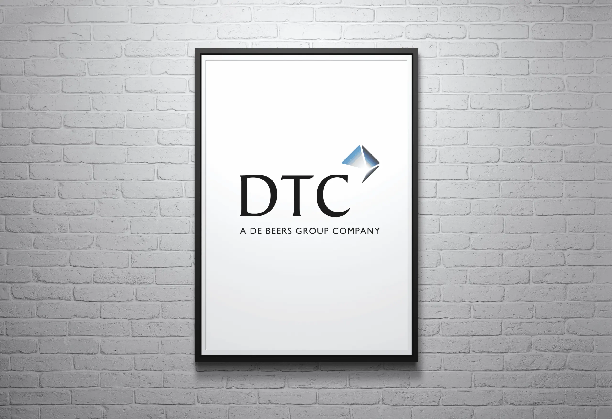 DTC De Beers Group Company logo - Black text with coloured icon top right - Brand Identity